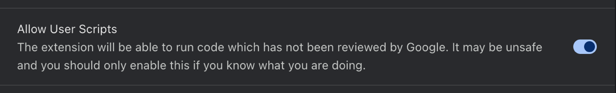 The Allow User Scripts row on a Chrome extension's details page, switched on, with Chrome's own warning that the extension will be able to run code which has not been reviewed by Google.